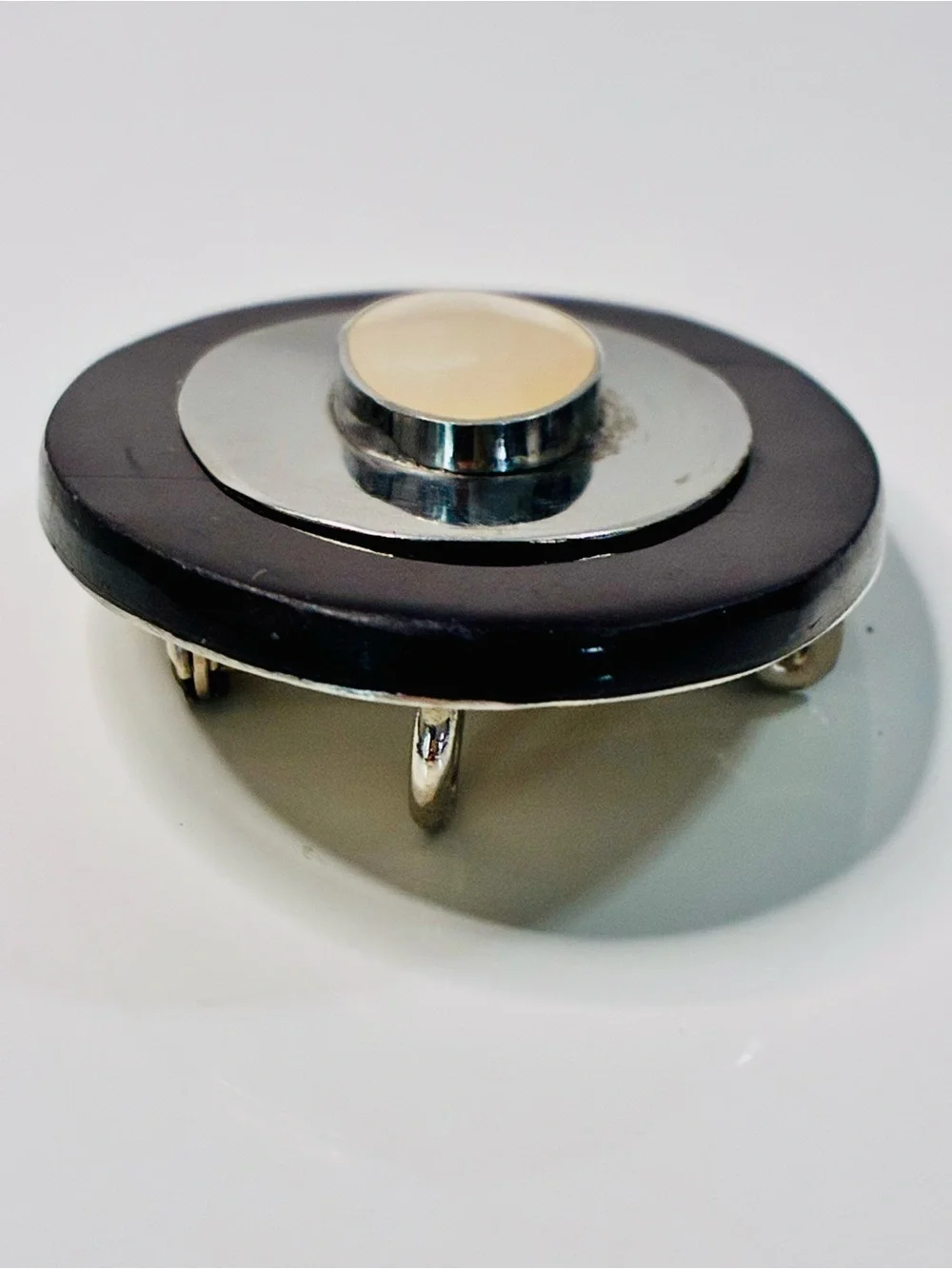 Elevated Simple Black and Silver Oval Brooch with Mother-of-Pearl Center Pendant